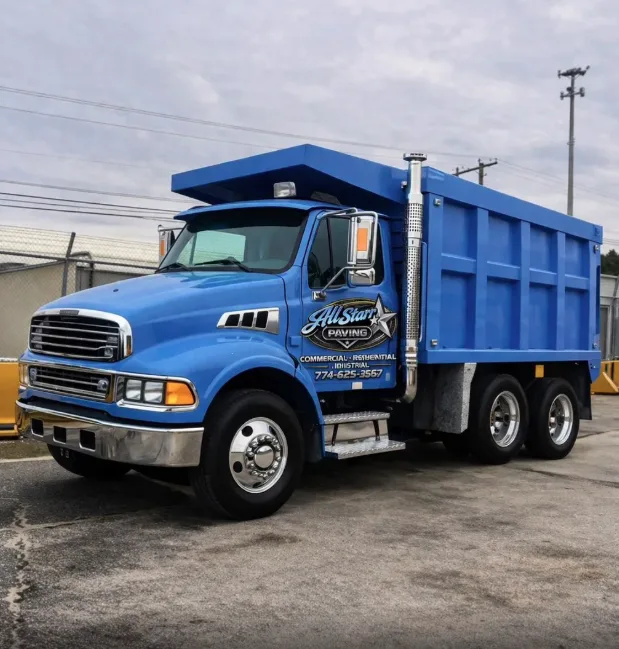 All Starr Paving blue dump truck with the company logo on the door